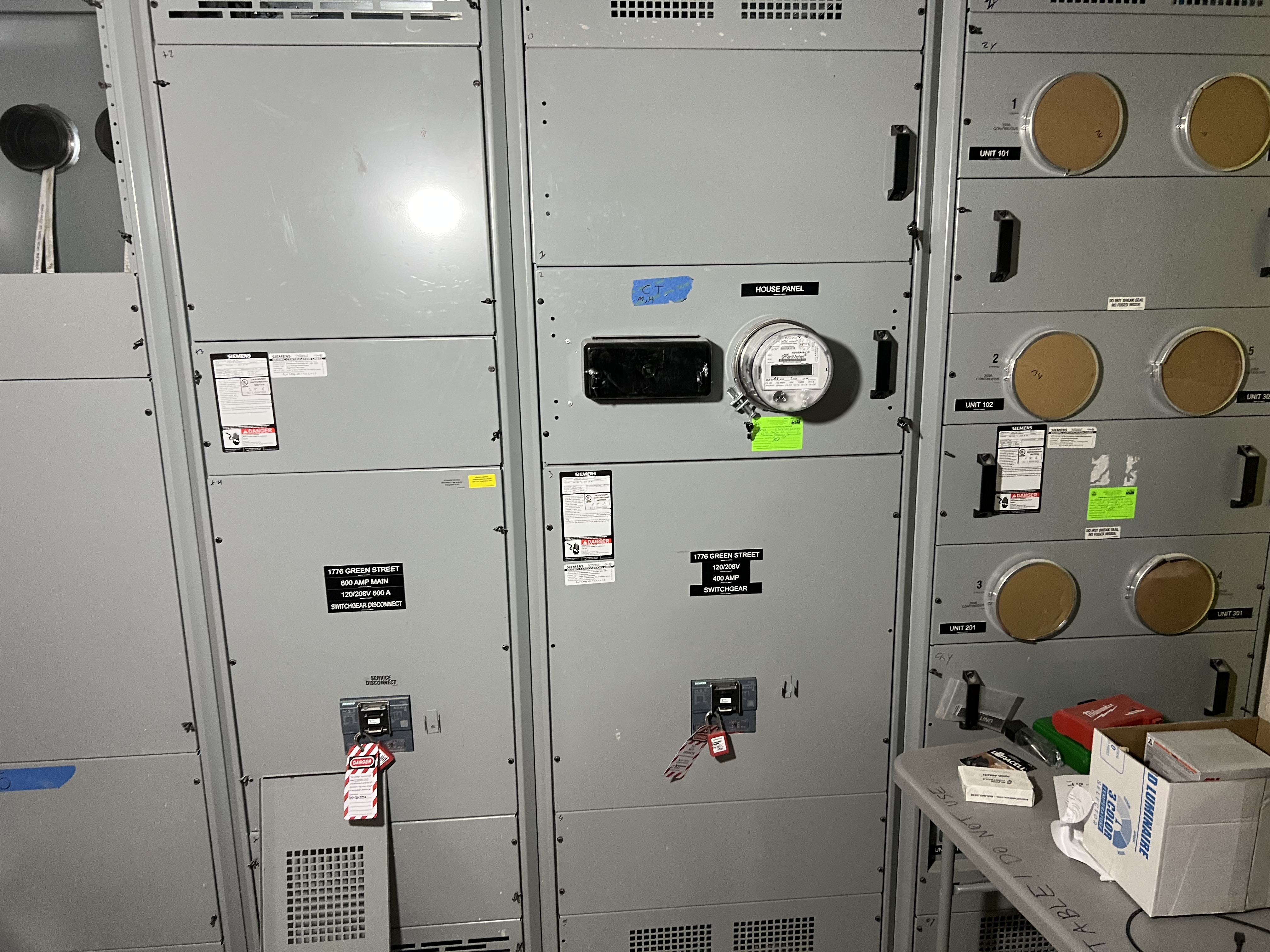 Multi-unit commercial switchgear installation with 600-amp main disconnect and individual unit panels